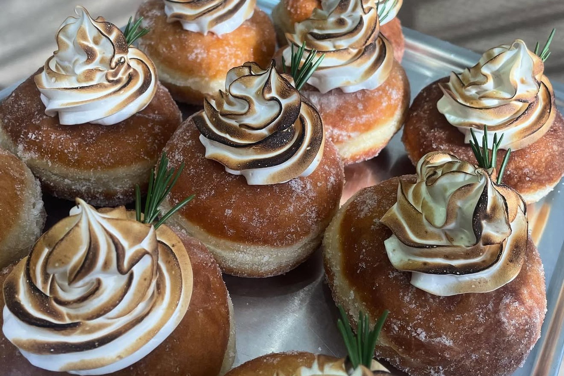 Greedy Cow Bakes — strawberry cream doughnuts at the counter